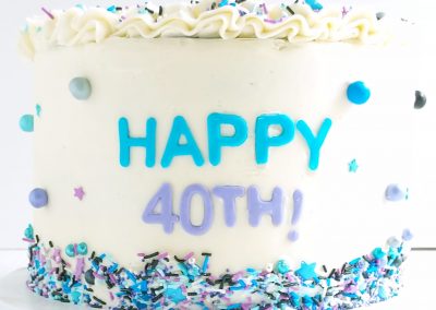 40th birthday cake with blue and purple sprinkles
